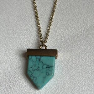 NWOT gold tone metal 15”. long necklace with faux, 1” turquoise stone pendant.